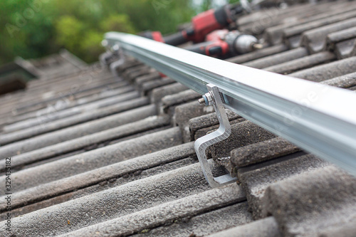 Close up of mounting rail for photovoltaic system on roof building site