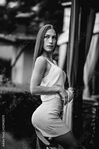 .Beautiful young girl posing while relaxing  business woman. Relaxation. Black and white.