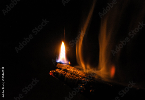 fire in the fireplace on a cold summer night
