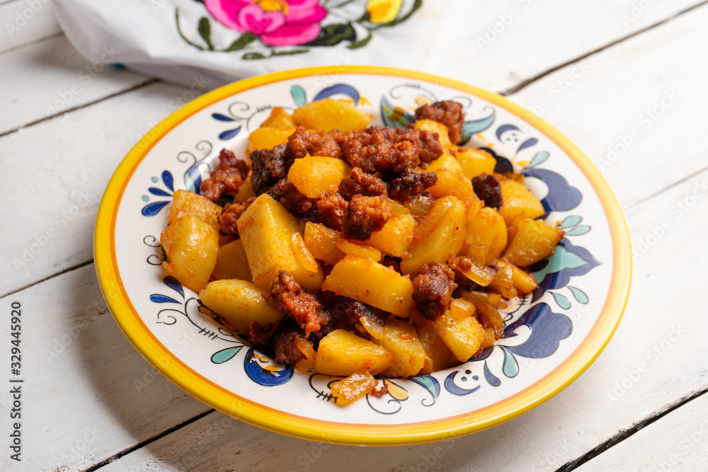 Mexican chorizo with potatoes on white background Mexican chorizo with potatoes on white background