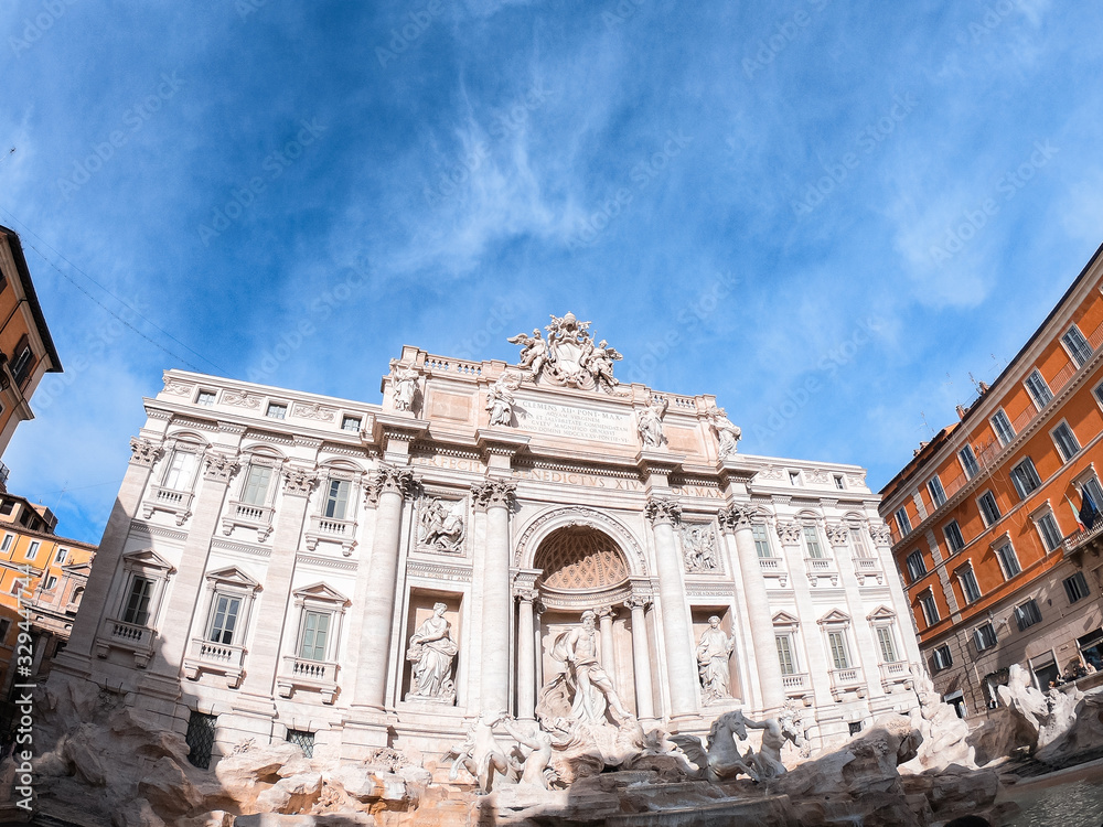 Beautiful view in Rome, tourists visiting the Trevi Fountain. Photograph of the Fontana di Trevi.
