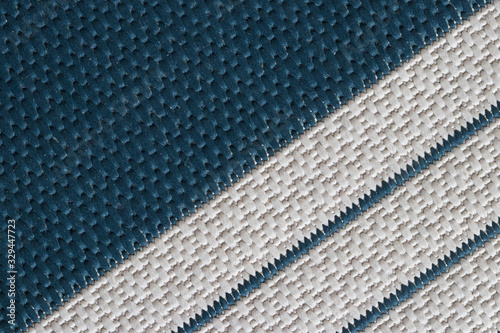 Closeup of a fabric texture background. Geometric shapes and lines