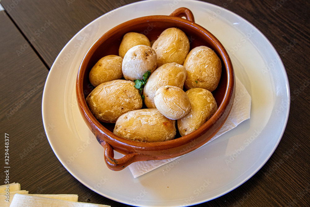 tasty healthy Canarian potatoes served in a retro vintage pot on the island of Gran Canaria tasty healthy Canarian potatoes served in a retro vintage pot on the island of Gran Canaria
