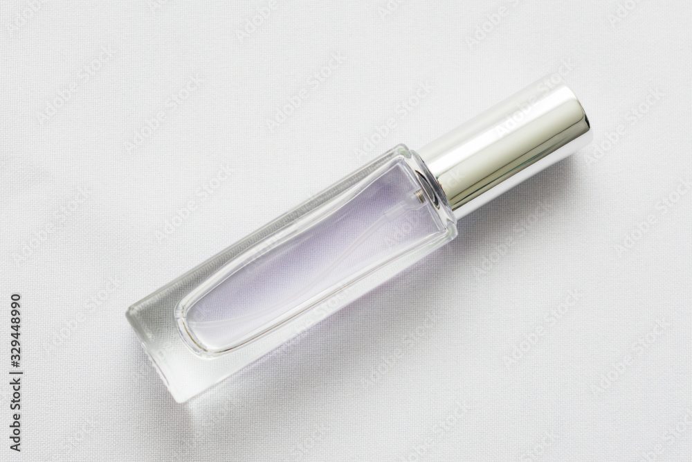 Blank clear perfume bottle on white background