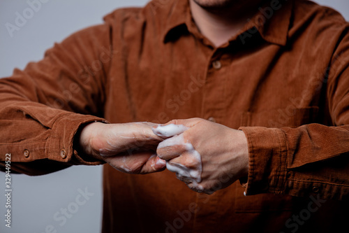 guy uses disinfectant gel on his hands