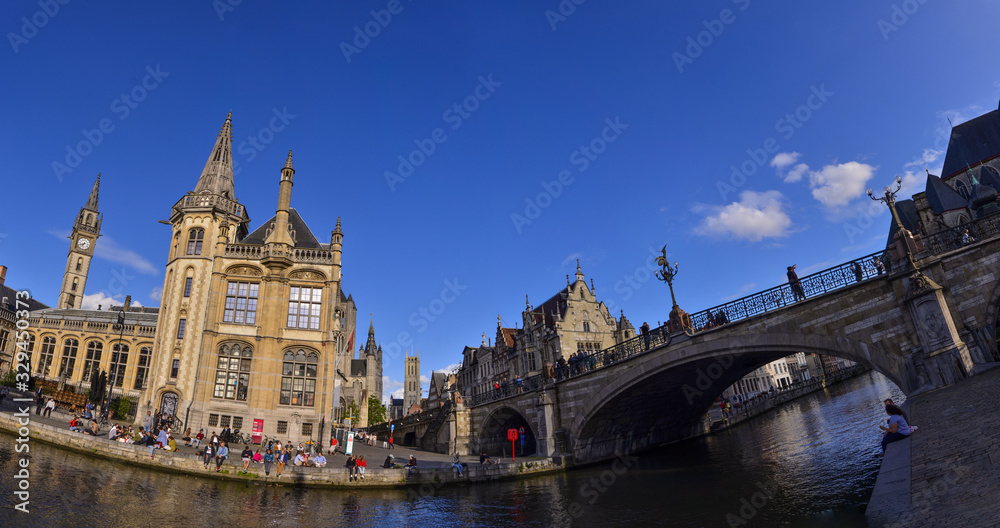 Ghent,Belgium,August 2019. Large format panoramic photo: breathtaking cityscape from the St.Michael bridge along the Graslei canal.One of the most beautiful postcards in the city. People stop to watch