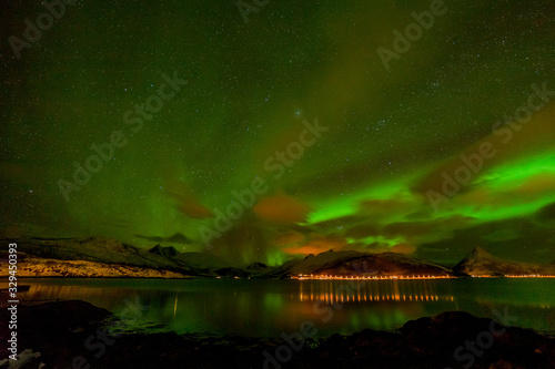 beautiful aurora borealis, polar lights, over mountains in the North of Europe - Lofoten islands, Norway