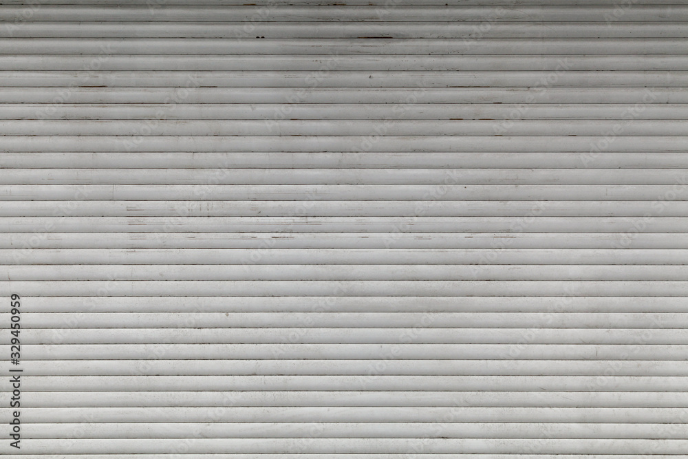 Old, dirty, horizontal texture of street metal shutters. Old, dirty, horizontal texture of street metal shutters.