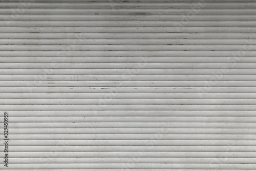 Old, dirty, horizontal texture of street metal shutters.