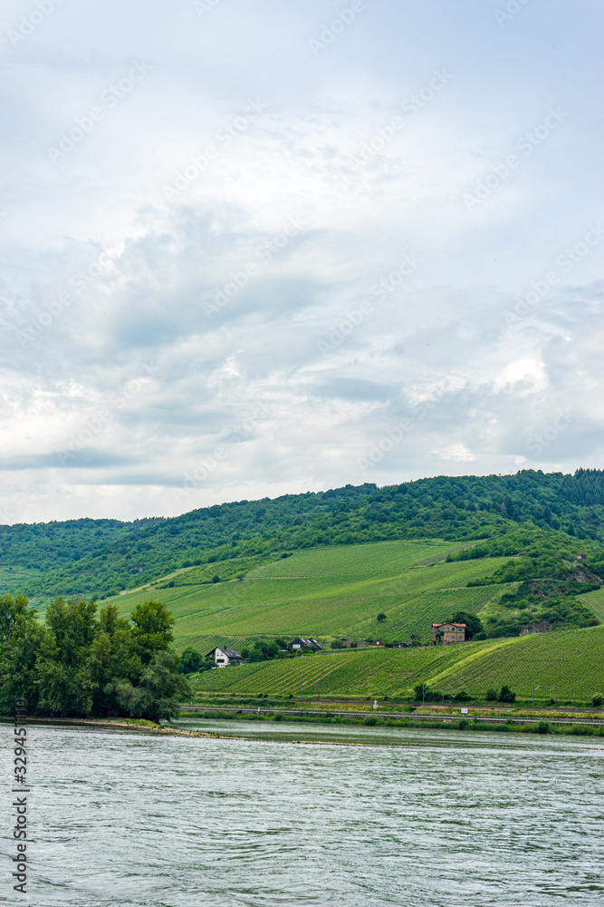 Germany, Rhine Romantic Cruise, a large body of water with a mountain in the background