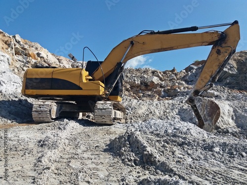 Backhoe is digging for gypsum ore at the mine