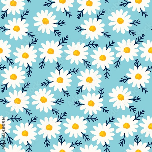 Fototapeta Naklejka Na Ścianę i Meble -  Daisy seamless pattern on blue background. Floral ditsy print with small white flowers and leaves. Chamomile design great for fashion fabric, trend textile and wallpaper.
