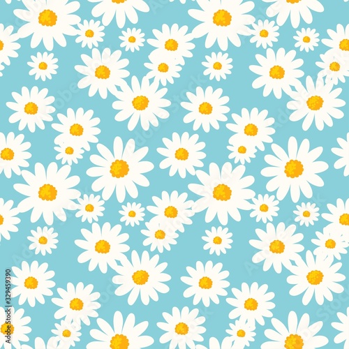 Daisy flower seamless pattern on blue background. Ditsy floral print with tiny chamomile great for fashion fabric, home decor textile and wallpaper.