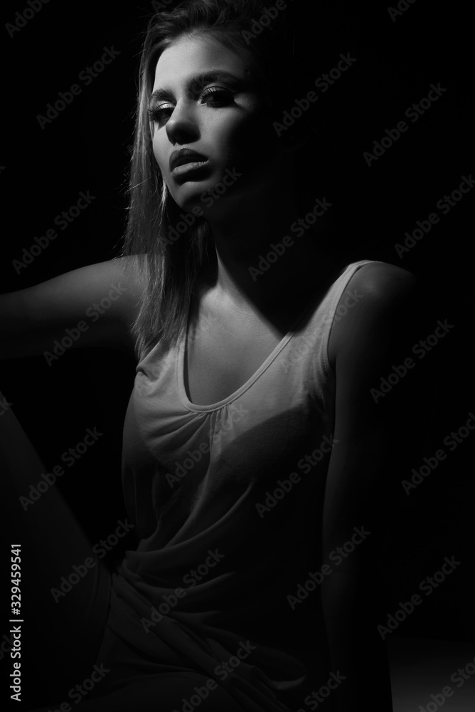 black and white portrait of fashion beautiful model, brunette girl with freckles in studio, close up, young woman head shot black and white portrait of fashion beautiful model, brunette girl with freckles in studio, close up, young woman head shot