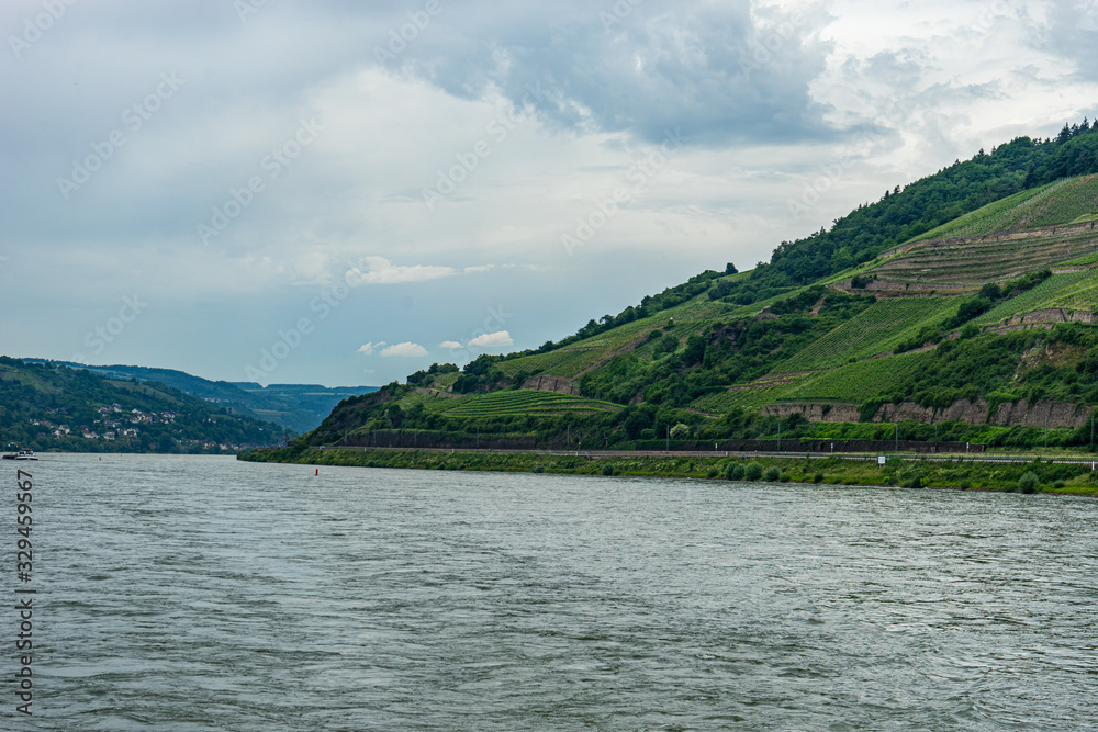 Germany, Rhine Romantic Cruise, a large body of water with a mountain in the background