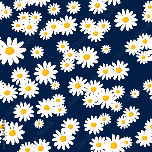 Daisy seamless pattern on dark blue background. Floral ditsy print with small white flowers. Chamomile design great for fashion fabric, trend textile and wallpaper.