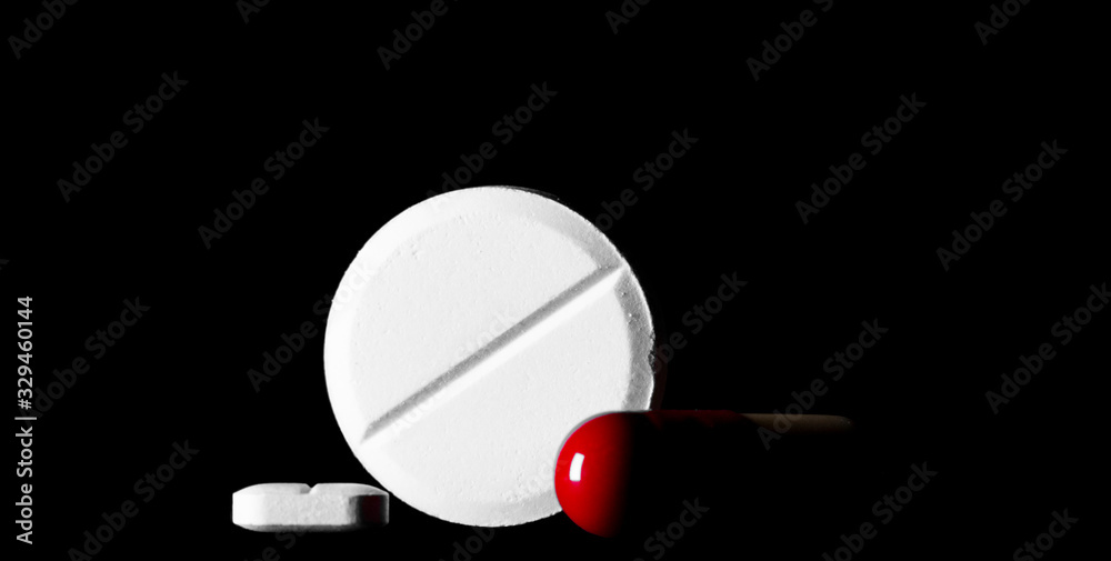Pills. Medical pills and capsules. Isolated on a black background(alpha channel). A fast-dissolving, effervescent tablet, allergy pill, antibiotics. Virus(Viral) and flu Diseases in Winter. Pills. Medical pills and capsules. Isolated on a black background(alpha channel). A fast-dissolving, effervescent tablet, allergy pill, antibiotics. Virus(Viral) and flu Diseases in Winter.