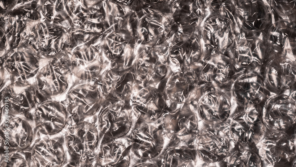Bubble wrap, background. Transparent and reliable packaging plastic material. The concept of planet pollution with plastic waste. Protective function. Bubble wrap, background. Transparent and reliable packaging plastic material. The concept of planet pollution with plastic waste. Protective function.