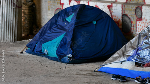 Homeless migrants in europe. Tent camp homeless under the bridge in berlin. The concept of social problems in Europe, the problem of migration, the problem of employment. © Kost9