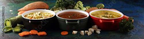 Set of soups from worldwide cuisines, healthy food. Broth with noodles, beef soup and broth with marrow dumplings. All soups with healthy vegetables on table