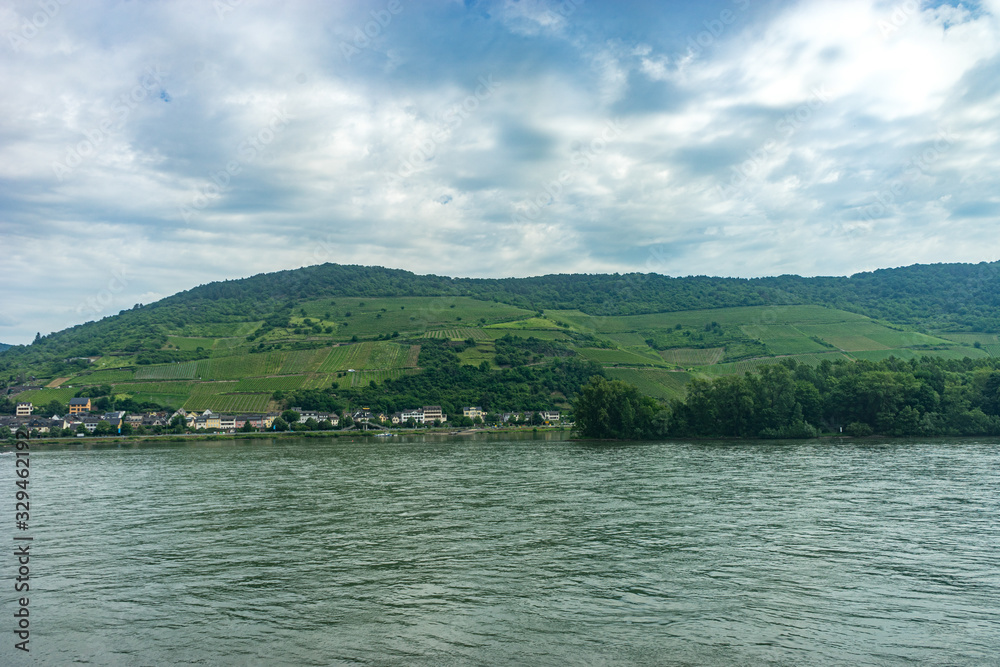 Germany, Rhine Romantic Cruise, a body of water with a mountain in the background