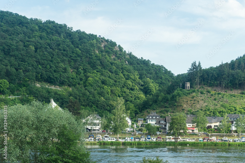 Fototapeta premium Germany, Hiking Frankfurt Outskirts, a large body of water with a mountain in the background