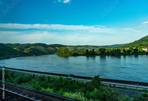 Germany, Hiking Frankfurt Outskirts, a train traveling down train tracks next to a body of water