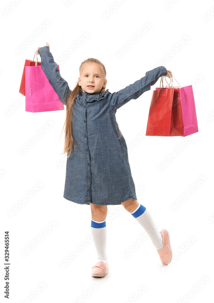 Cute little girl with shopping bags on white background Cute little girl with shopping bags on white background