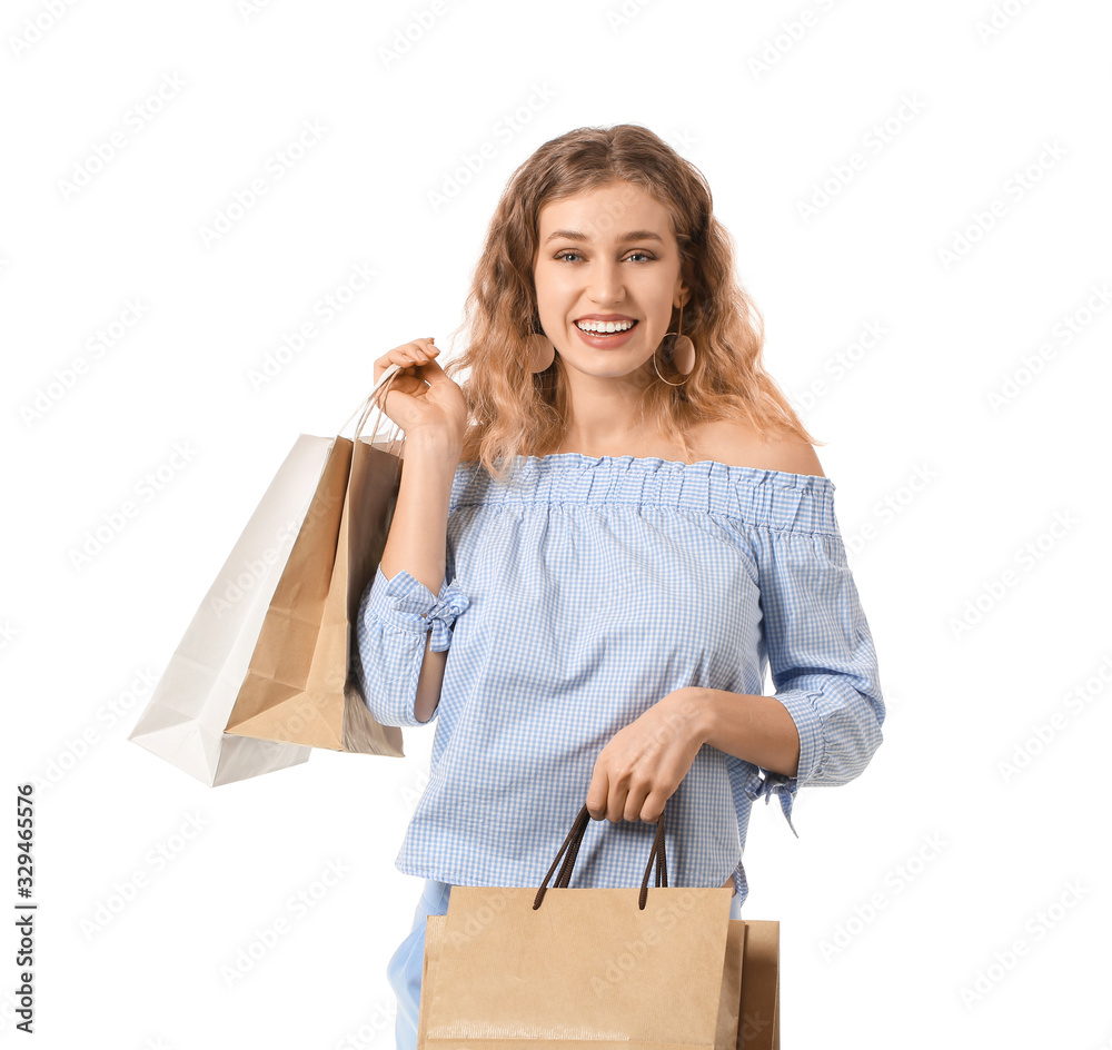 Beautiful young woman with shopping bags on white background Beautiful young woman with shopping bags on white background