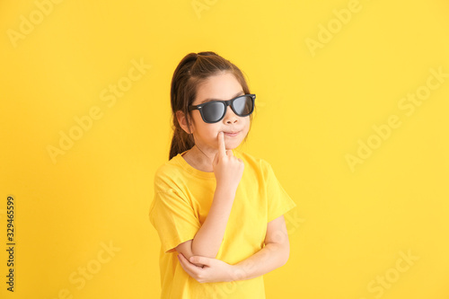 Funny little girl with sung...