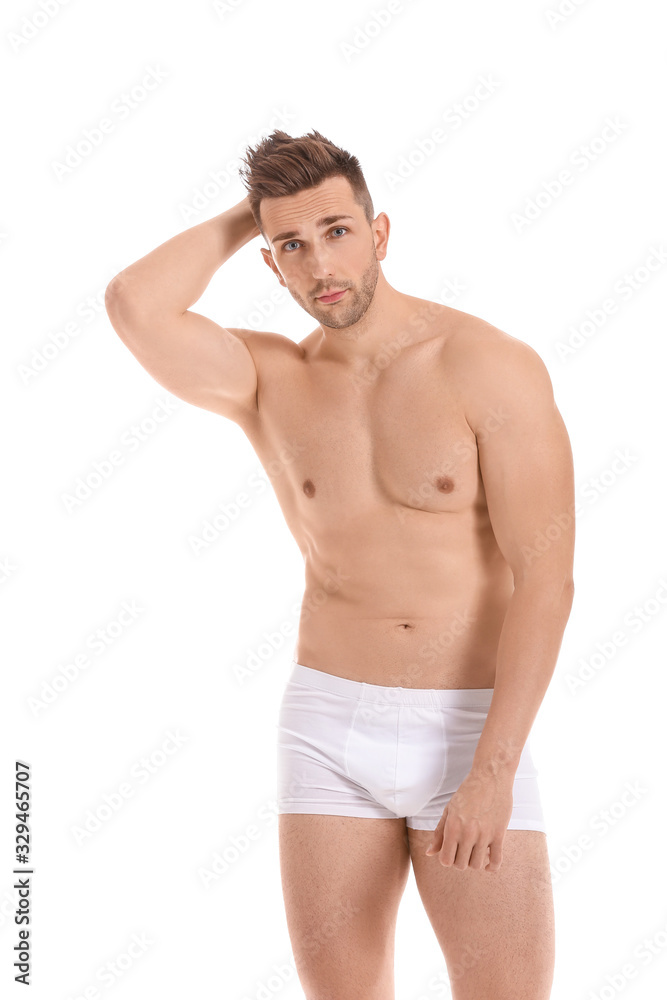 Handsome man in underwear on white background