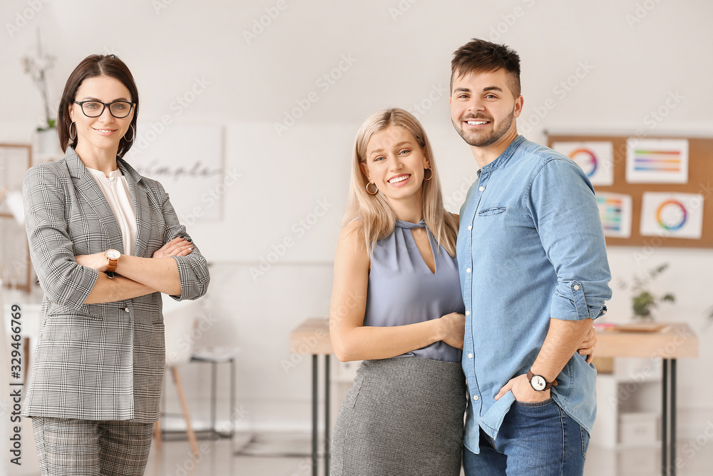 Fototapeta premium Female interior designer with couple in office