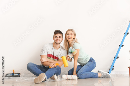 Happy young couple planning...