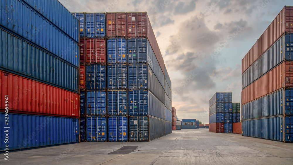 Fototapeta premium perspective view of containers at containers yard with forklift and truck