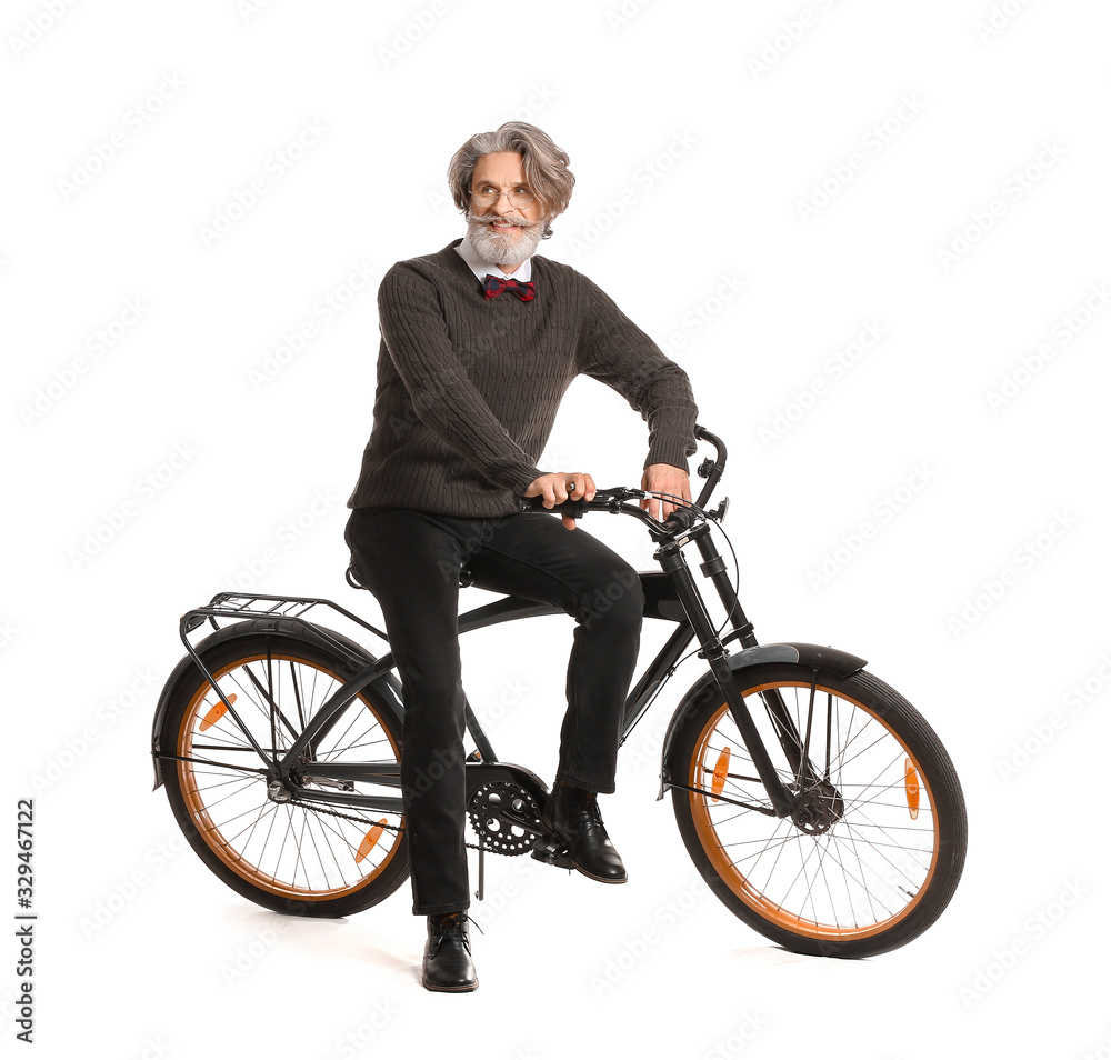 Stylish elderly man with bicycle on white background Stylish elderly man with bicycle on white background