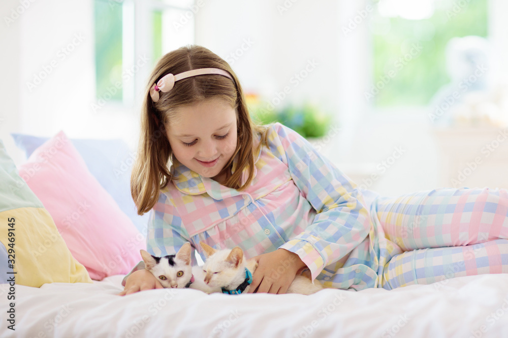 Child playing with baby cat. Kid and kitten. Child playing with baby cat. Kid and kitten.