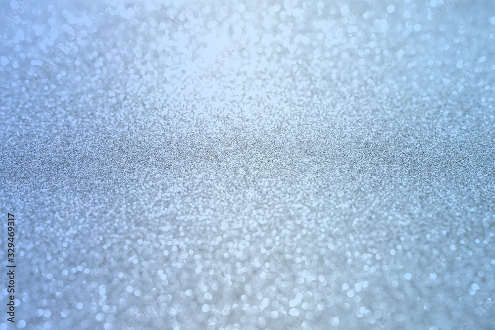 Blue silver glitter bokeh texture christmas abstract background.