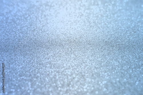 Blue silver glitter bokeh texture christmas abstract background.