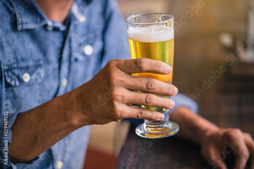 Canvas Print Happy friends drinking and toasting beer at brewery bar restaurant