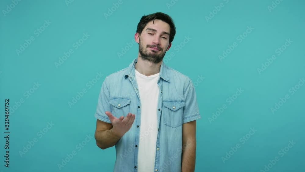This is me! Ambitious self-confident masculine guy in jeans shirt pointing himself and looking at camera with arrogance, expressing pride in his achievements. studio shot isolated on blue background This is me! Ambitious self-confident masculine guy in jeans shirt pointing himself and looking at camera with arrogance, expressing pride in his achievements. studio shot isolated on blue background