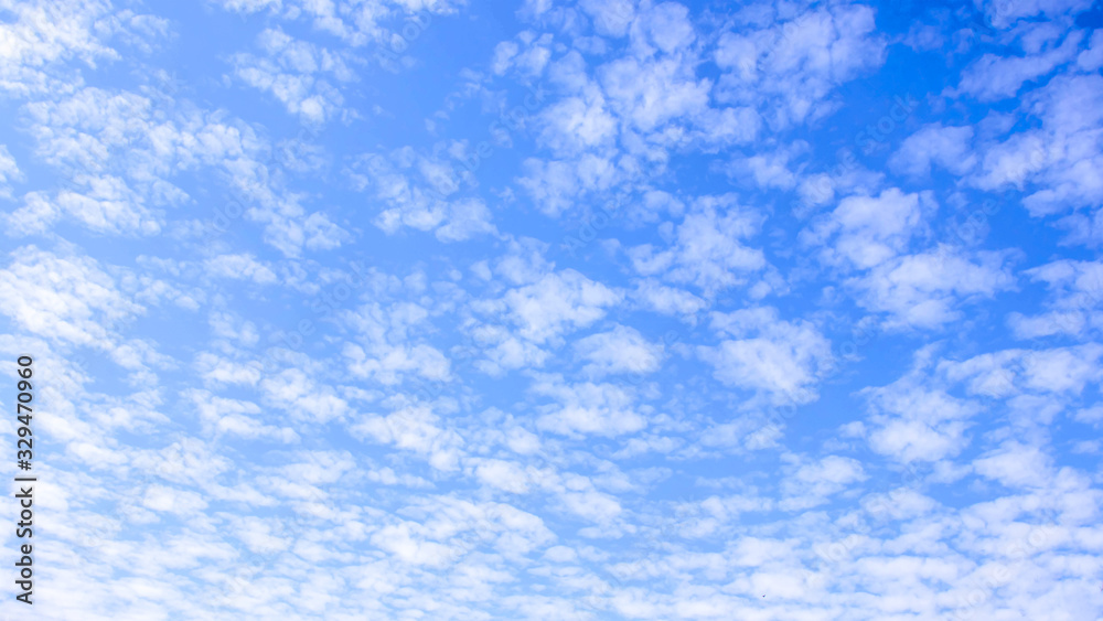 Blurred white clouds on the sky background.