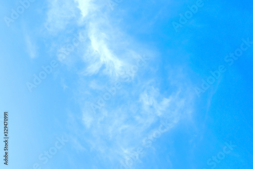 Blurred white clouds on the sky background.