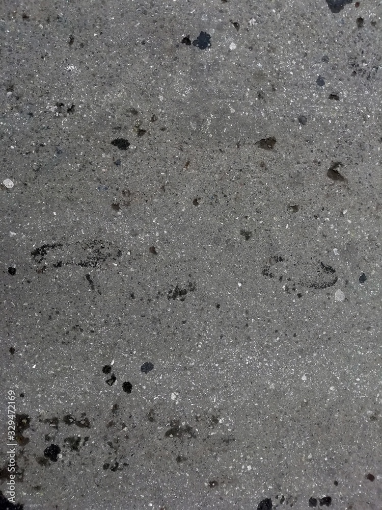 The texture of gray asphalt. View top The texture of gray asphalt. View top