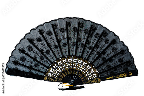 Lace black and gold hand fan isolated on white  background. Spanish or Chinese influence. Flamenco fan.