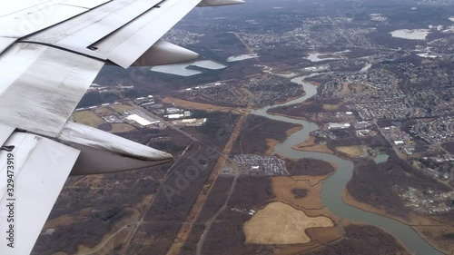 Flying Over River and Rural Farmland, Window Seat Plane View photo