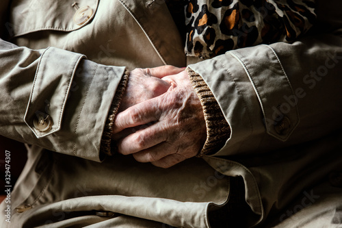 Caring hands of an old woman. Grandmother's hands with skin wrinkles. Old caring hands.