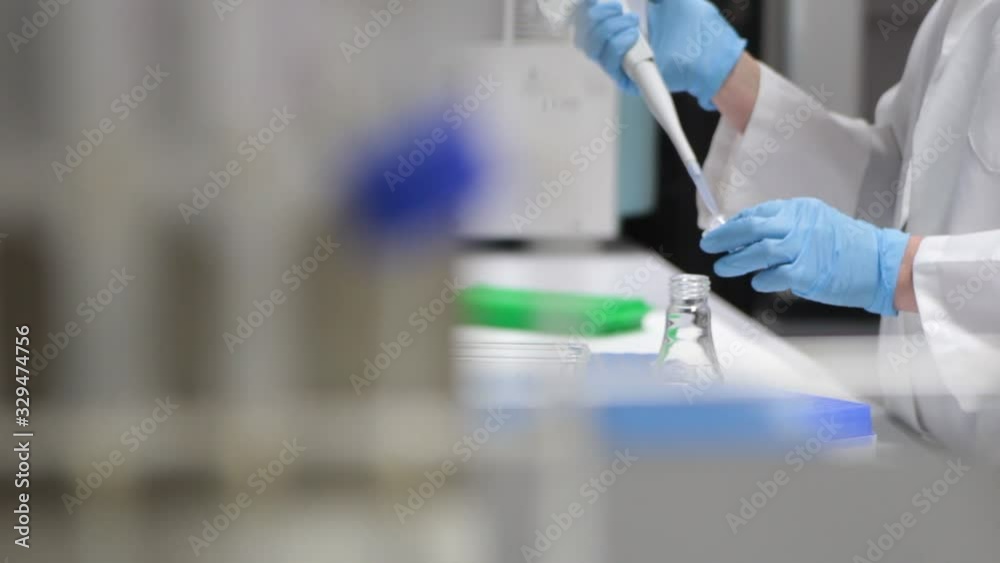 Doctor taking carefully an example in laboratory Doctor taking carefully an example in laboratory