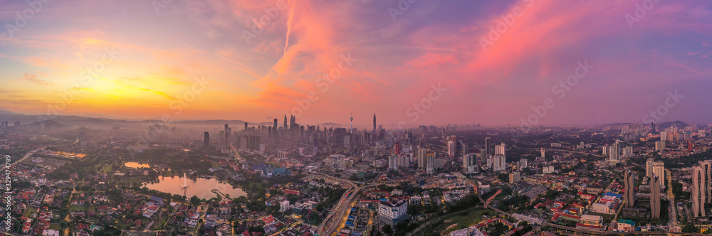 Aerial panorama cityscape view in the middle of Kuala Lumpur city center during sunrise, Malaysia