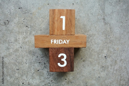 Friday 13th on wooden calendar. bad luck, Misfortune Day, Halloween Concept.