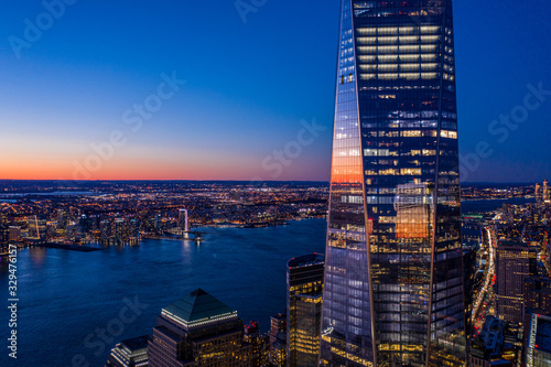 Aerial view of New York city and one world trade center brookfield place at dusk. photo